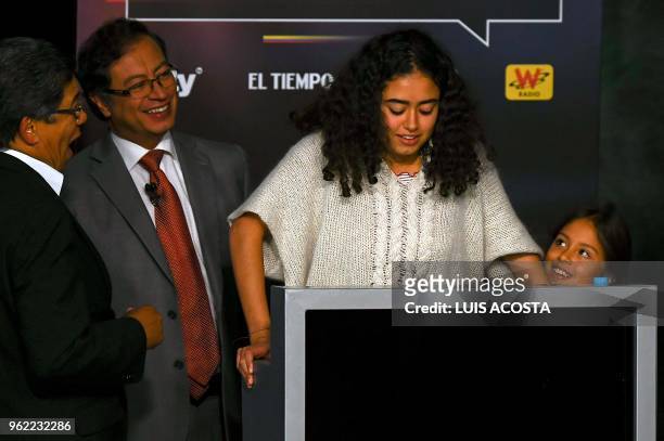 Colombian presidential Gustavo Petro for the Colombia Humana Party, jokes whit his daugthers Sofia and Antonella during a TV debate in Bogota on May...