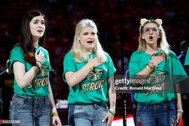 The Santa Fe High School choir performs the national anthem as part of a tribute to honor the victims of the May 18th shooting that left ten dead and...