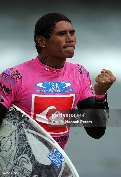 Tamaroa McComb of Tahiti celebrates after qualifying for the Boys Under 18 division final during the Quiksilver ISA World Junior Surfing...