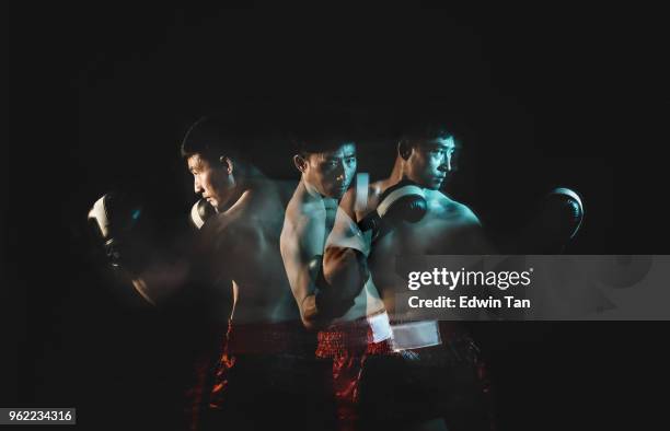 multiple exposure for asian chinese male with boxing gloves - martial arts instructor stock pictures, royalty-free photos & images