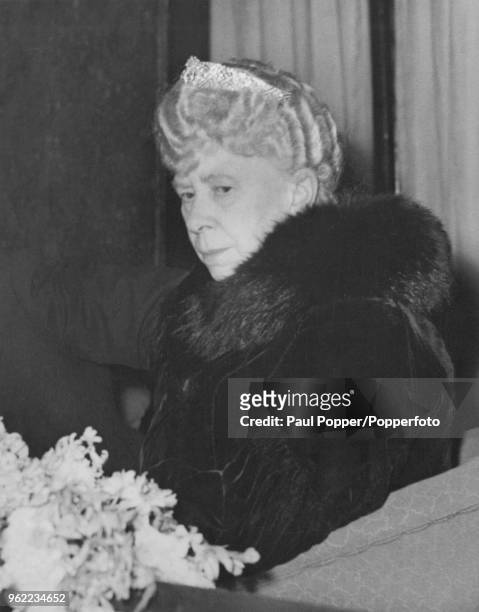Queen Mary watching a performance of Emile Littler's pantomime, 'Little Miss Muffet' from the Royal Box at the London Casino, 20th December 1949. She...
