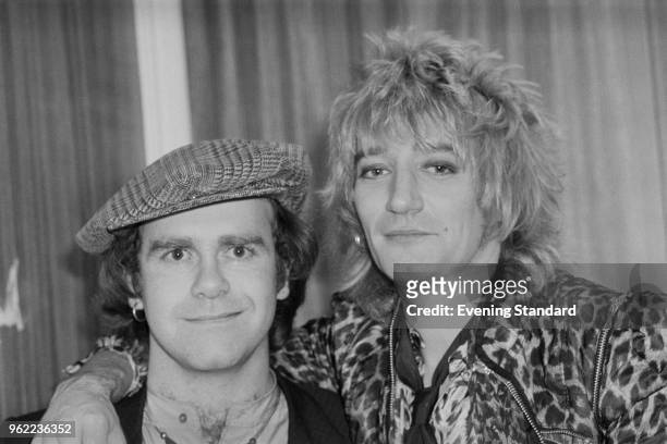British singer, pianist and composer Elton John with British rock singer and songwriter Rod Stewart at the Olympia, London, UK, 22nd December 1978.