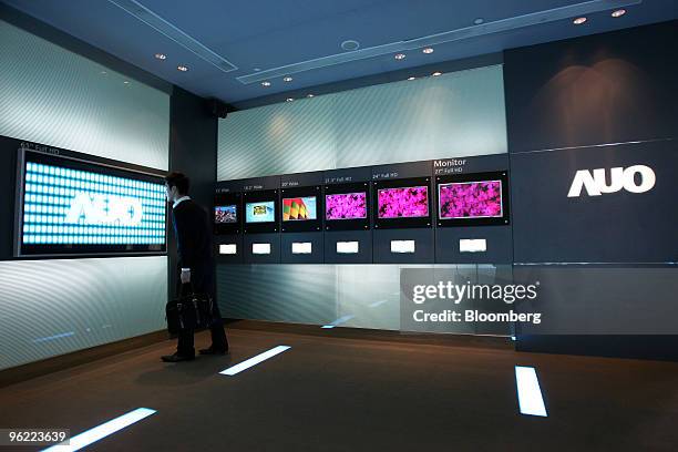 Visitor looks at liquid-crystal display screens at AU Optronics Corp.'s headquarters in Hsinchu, Taiwan, on Tuesday, Jan. 26, 2010. AU Optronics...