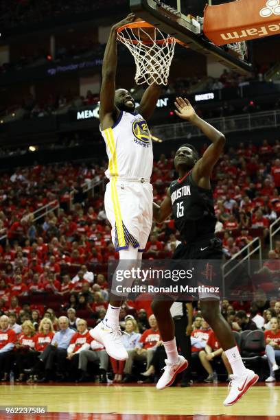 Draymond Green of the Golden State Warriors dunks against Clint Capela of the Houston Rockets in the third quarter of Game Five of the Western...