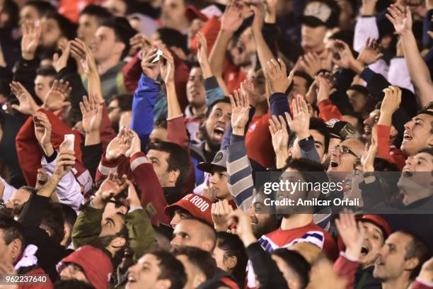 Fans of Independiente cheer for their team during a match between Independiente and Deportivo Lara as part of Copa CONMEBOL Libertadores 2018 at...