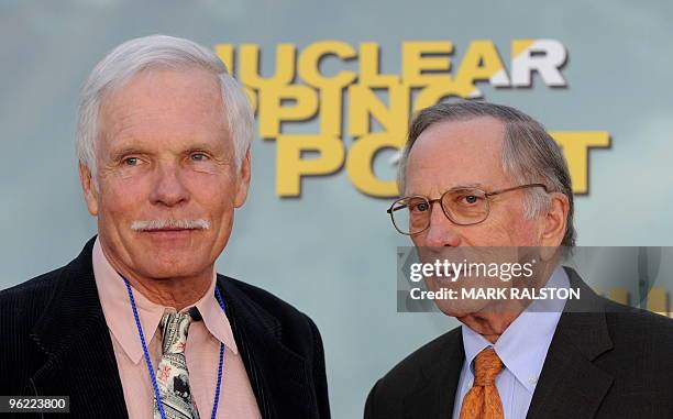 Founder Ted Turner and former Senator Sam Nunn arrive on the red carpet for the premiere of the documentary film 'Nuclear Tipping Point' at the...