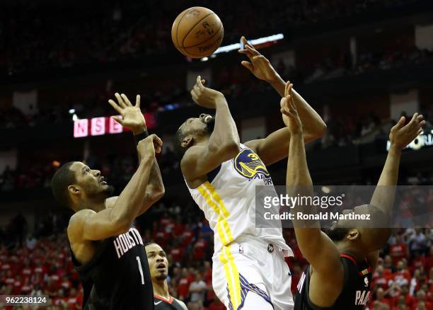 Kevin Durant of the Golden State Warriors goes up against Chris Paul and Trevor Ariza of the Houston Rockets in the third quarter of Game Five of the...