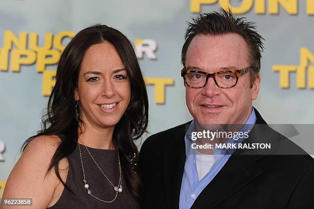 Comedian Tom Arnold and his new wife Ashley arrive on the red carpet for the premiere of the documentary film 'Nuclear Tipping Point' at the...