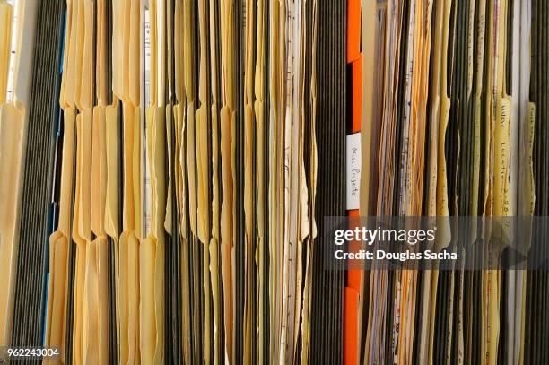 full frame of file folders in an open file cabinet - archival office stock pictures, royalty-free photos & images