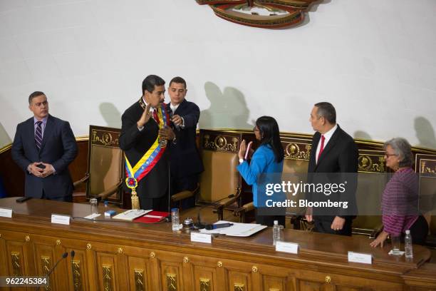 Nicolas Maduro, Venezuela's president, second left, takes the oath of office during a swearing-in ceremony in Caracas, Venezuela, on Thursday, May...