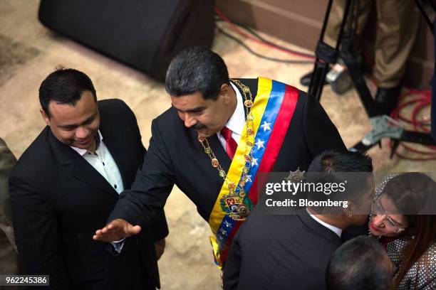 Nicolas Maduro, Venezuela's president, center, greets lawmakers during a swearing-in ceremony in Caracas, Venezuela, on Thursday, May 24, 2018. After...