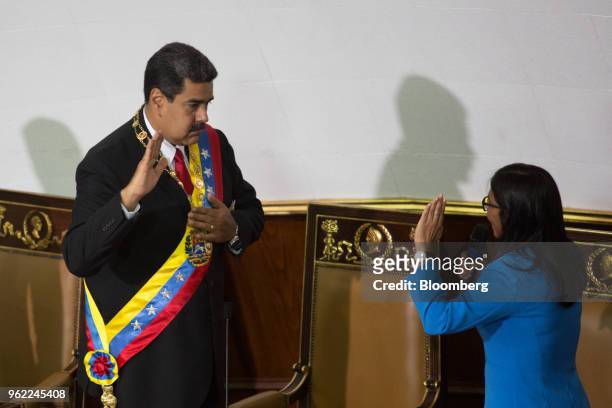 Delcy Rodriguez, president of the Constituent Assembly, right, speaks as Nicolas Maduro, Venezuela's president, takes the oath of office during a...