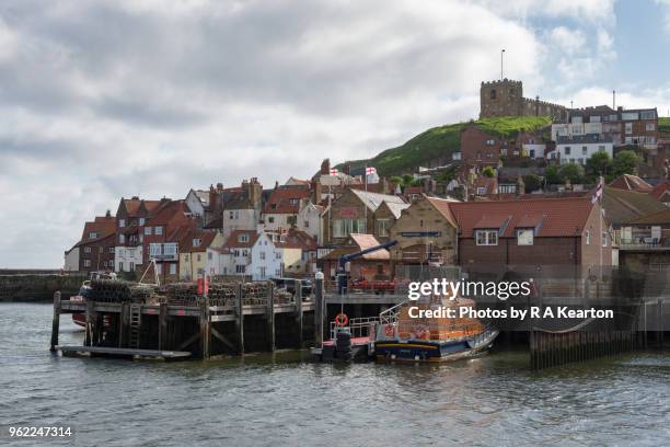 lifeboat station and abbey wharf, whitby, north yorkshire, england - lifeboat stock pictures, royalty-free photos & images