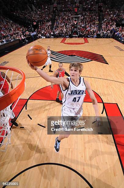 Andrei Kirilenko of the Utah Jazz goes up for a shot past Jerryd Bayless of the Portland Trail Blazers during a game on January 27, 2009 at the Rose...