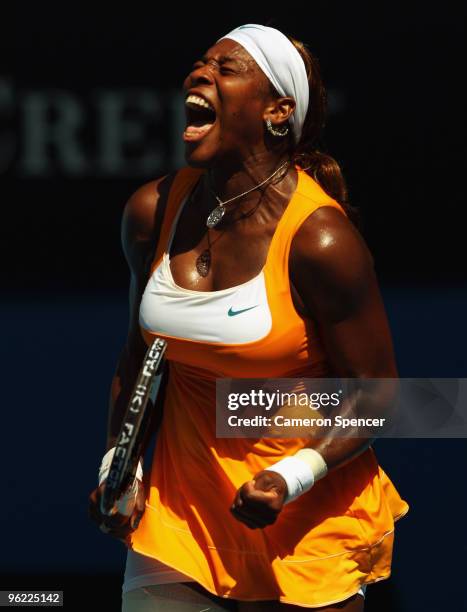 Serena Williams of the United States of America celebrates winning match point in her semifinal match against Na Li of China during day eleven of the...