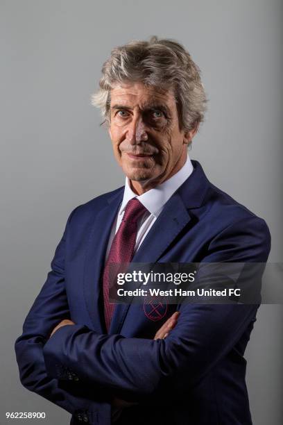 West Ham United's new manager Manuel Pellegrini poses at Rush Green on May 23, 2018 in Romford, England.