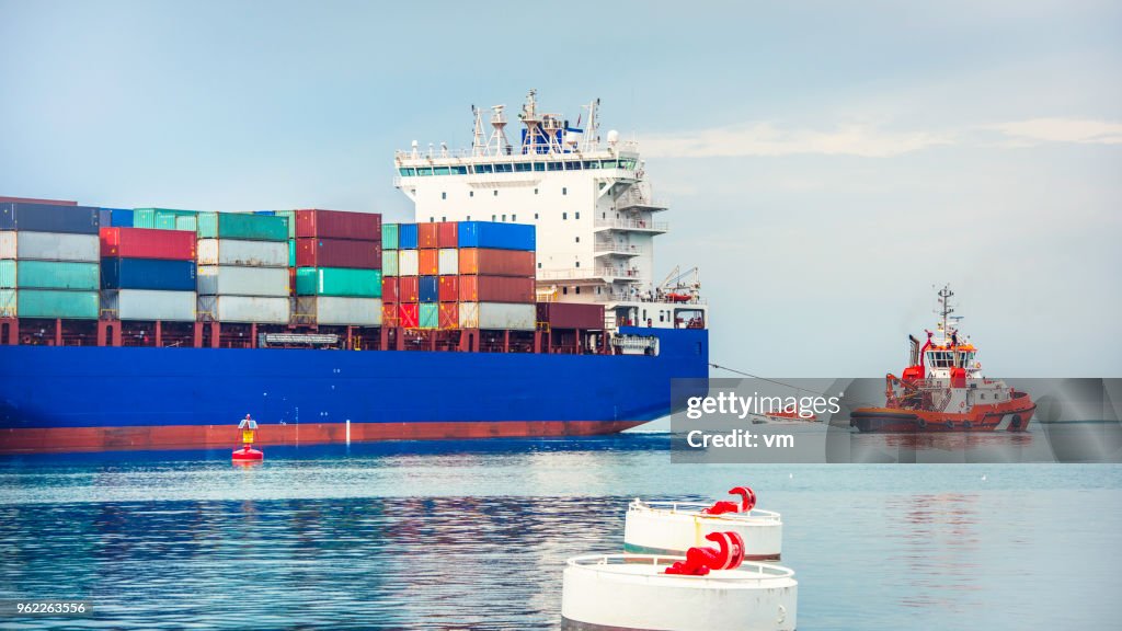 Tugboat and container ship