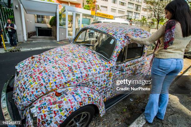 Fusca full of figurines is seen in the streets of Sao Paulo, Brazil, on 25 May 2018. The owner said that his friends glued 15,000 figurines from the...