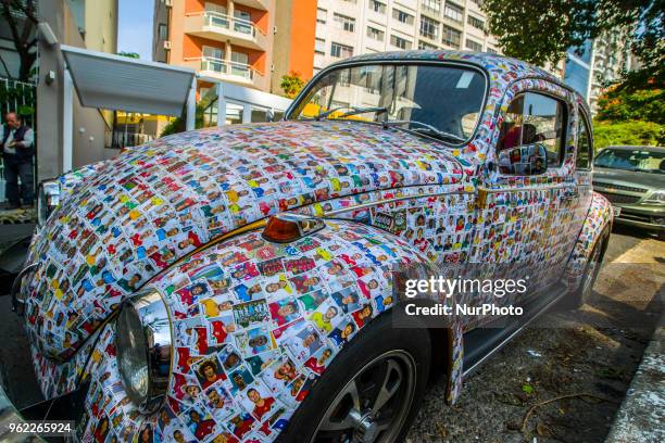 Fusca full of figurines is seen in the streets of Sao Paulo, Brazil, on 25 May 2018. The owner said that his friends glued 15,000 figurines from the...