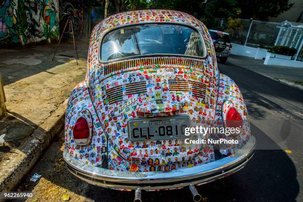 Fusca full of figurines is seen in the streets of Sao Paulo, Brazil, on 25 May 2018. The owner said that his friends glued 15,000 figurines from the...