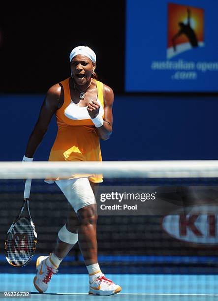 Serena Williams of the United States of America celebrates winning a point in her semifinal match against Na Li of China during day eleven of the...