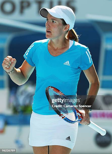 Justine Henin of Belgium celebrates winning a point in her semifinal match against Jie Zheng of China during day eleven of the 2010 Australian Open...