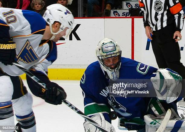 Roberto Luongo of the Vancouver Canucks makes a save off the breakaway shot of Andy McDonald of the St. Louis Blues during their game at General...
