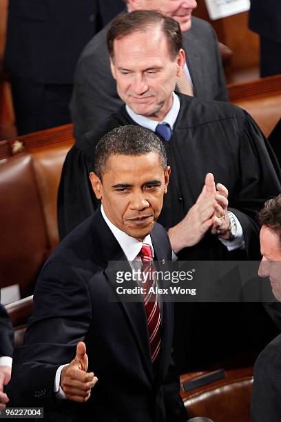Supreme Court Justice Samuel Alito looks on on as U.S. President Barack Obama enters the chamber before speaking to both houses of Congress during...