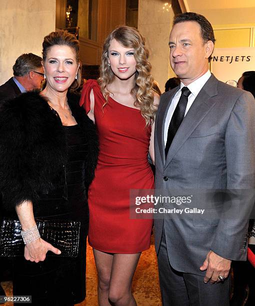 Actress Rita Wilson, singer Taylor Swift, and actor Tom Hanks attend the Neuro hosted cocktail hour and juniors room at the EIF's Women's Cancer at...