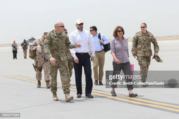 Chief of staff for Train Col Peter B. Cross walking with congresswoman for the state of California Susan Davis at Kandahar Airfield, Afghanistan, May...