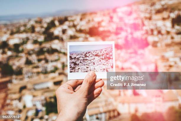 close-up of an instant photograph of the albaicin neighborhood of granada - albaicín fotografías e imágenes de stock