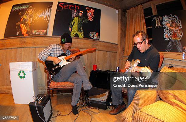 Jacob Wester and Steve Zeldin jam on the guitar in the back room at the Oakley/Red Bull Party prior to Winter X Games 14 at Buttermilk Mountain on...