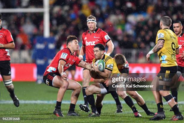 Nehe Milner-Skudder of the Hurricanes is tackled during the round 15 Super Rugby match between the Crusaders and the Hurricanes at AMI Stadium on May...