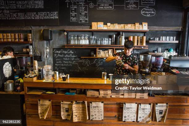 Barista is photographed at Ristr8to Coffee in Chiang Mai, Thailand.