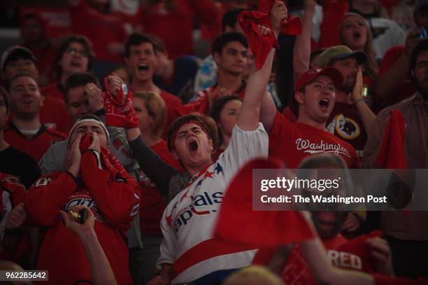 Fans celebrate a second goal of the Washington Capitals during a free viewing party during which fans can watch the game on the jumbotron at the...