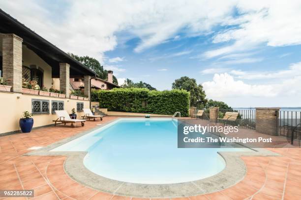 The exterior and pool of Daniela Deane's home, the "Lira Pit" above a big lake in the little town of Trevignano, just north of Rome.