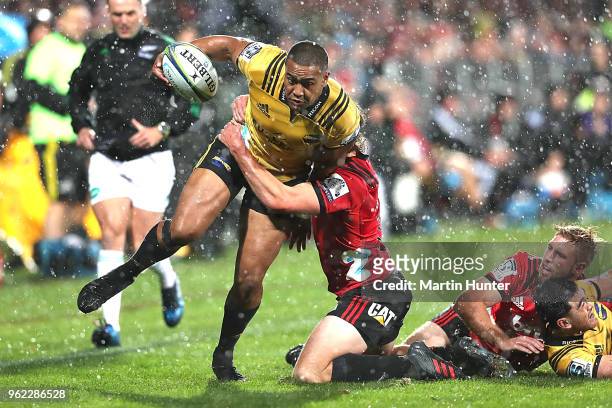 Julian Savea of the Hurricanes is tackled during the round 15 Super Rugby match between the Crusaders and the Hurricanes at AMI Stadium on May 25,...