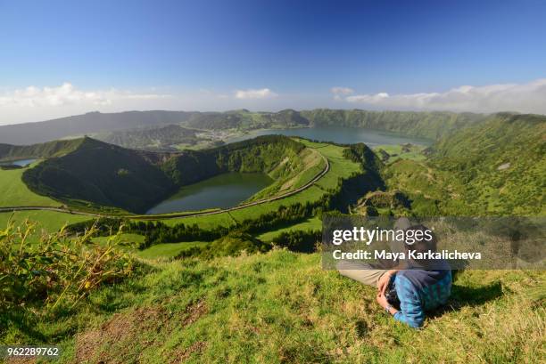 man resting near sete cidades lakes, sao miguel island, azores, atlantic ocean, portugal - agua estancada fotografías e imágenes de stock