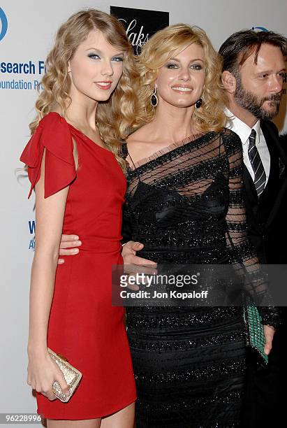 Singer Taylor Swift and singer Faith Hill arrive to the EIF's Women's Cancer Research Fund Hosts "An Unforgettable Evening Benefit at the Beverly...