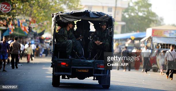 Sri Lanka army commandos travel in a pick-up truck in Colombo on January 28, 2010. Sri Lankan President Rajapakse won a second term, defeating former...