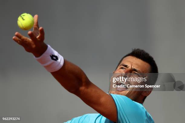 Bernard Tomic of Australia serves during his French Open third round menÕs qualifying singles match against Goncalo Oliveira of Portugal at Roland...