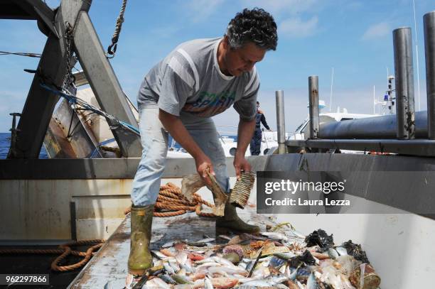 Fish and plastic waste inside the nets on a fishing boat during the operations of 'Arcipelago Pulito ' project in the Tyrrhenian Sea on May 24, 2018...