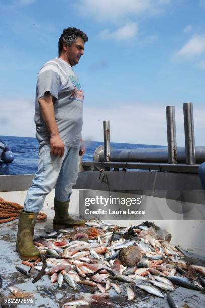 Fish and plastic waste inside the nets on a fishing boat during the operations of 'Arcipelago Pulito ' project in the Tyrrhenian Sea on May 24, 2018...