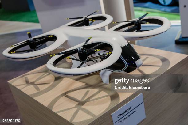 Model of a City Airbus flying taxi, developed by Airbus SE, sits on the company's stand during the Viva Technology conference in Paris, France, on...