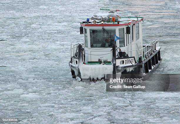 An icebreaker churns through ice in the Dahme river in the district of Koepenick on January 28, 2010 in Berlin, Germany. Though temperatures are mild...