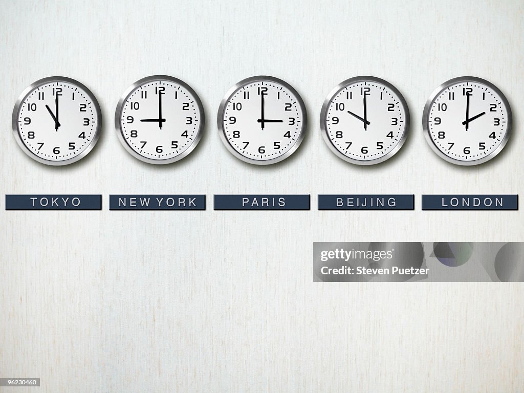 International time zone clocks on wall