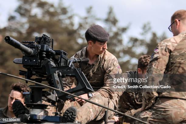 Army crew commander Cpl Nicolas Steri teaching soldiers from the 1st The Queen's Dragoon Guards to use an L134A1 Grenade Machine Gun at Bemowo Piskie...