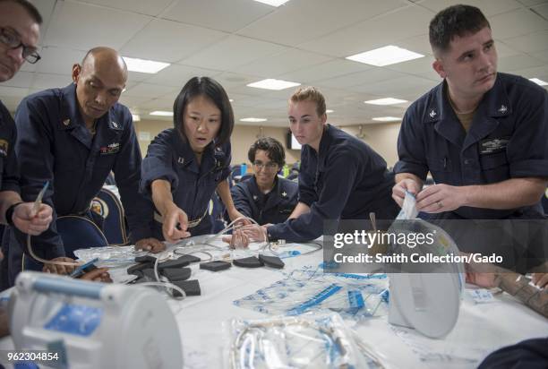 Sailors learning negative pressure wound therapy during a skin and wound care course at Military Sealift Command hospital ship USNS Mercy , May 14,...