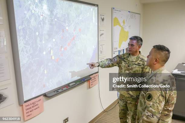 Hawaii Task Force commander Lt Col Shawn Tsuha explaining the ongoing volcanic activity to the Hawaii National Guard deputy adjutant general Kenneth...