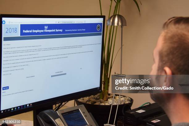 Photograph of a federal employee viewing the Federal Employee Viewpoint Survey on a computer, Buffalo, New York, May 15, 2018.
